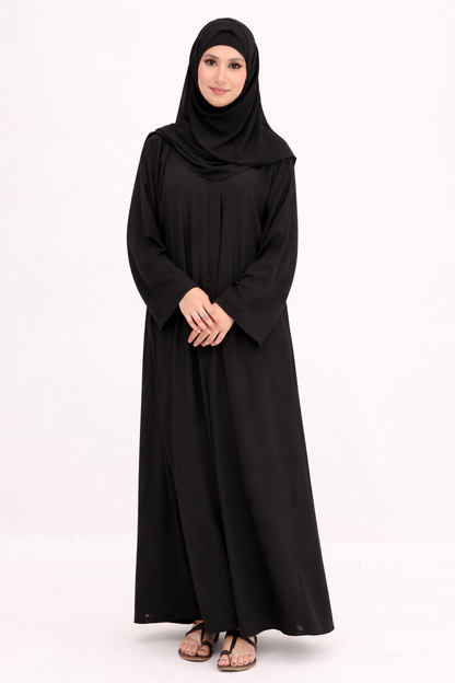 Woman wearing a black abaya and hijab