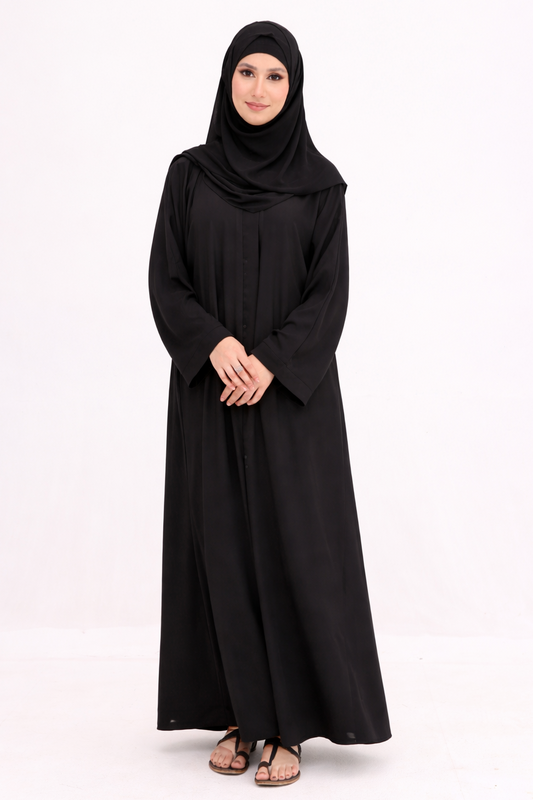 Woman wearing a black abaya and hijab