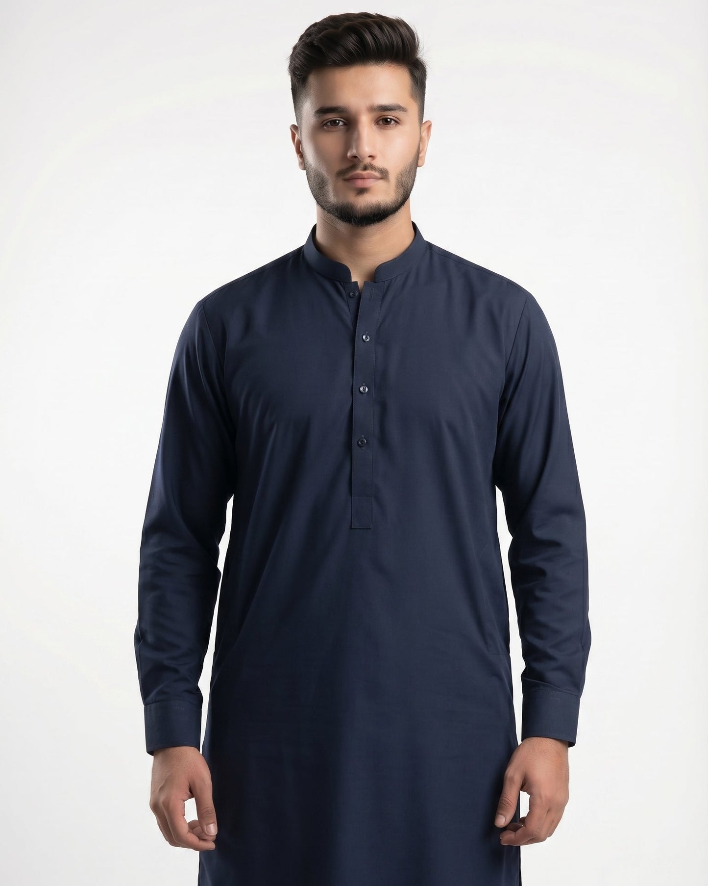 Man wearing a navy blue kurta against a white background