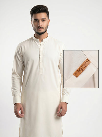 Man wearing a white traditional outfit with a close-up of the fabric label on a white background